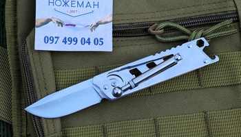 Складной нож с поршневым замком